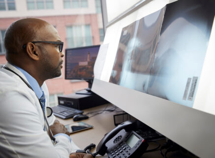 African american doctor looking at x-rays